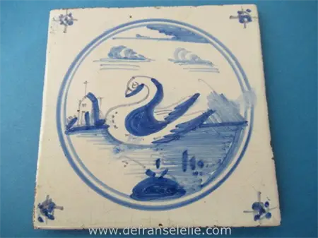 an antique Dutch Delft tile swan