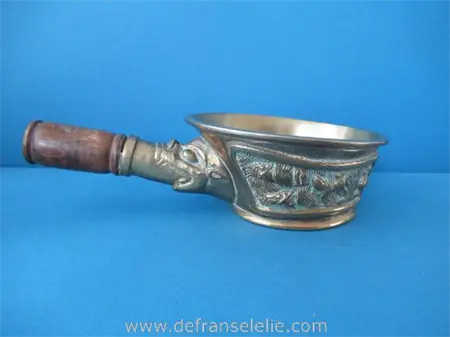 a vintage Chinese bronze grain scoop with wooden handle